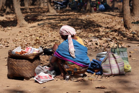 Woman selling drink and snacks in Pamela market