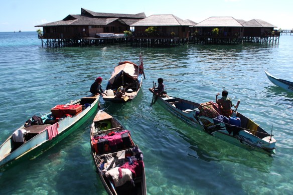 Local boats in front of a resort on Mabul