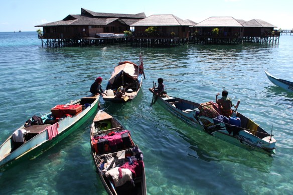 Local boats in front of a resort on Mabul